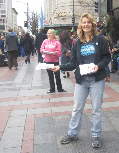 Rachel and Paris offering flyers and samples
